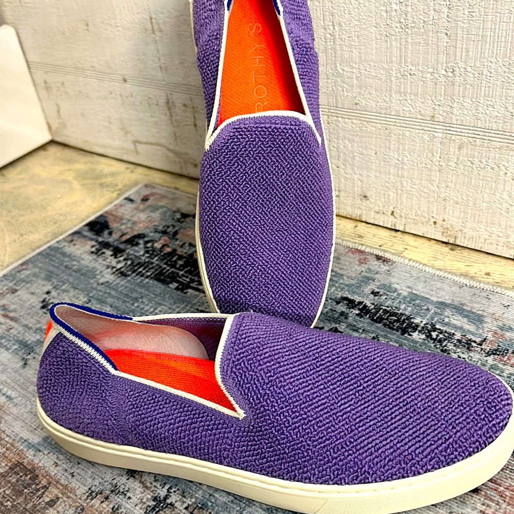 Like new Rothy’s size 10 purple with blue heel stitching & white trim.